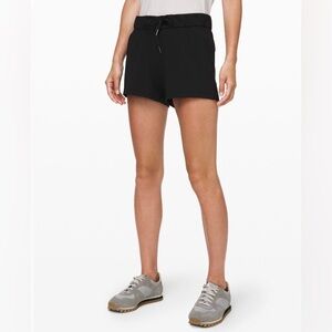 2 pairs of Lululemon Athletica Black & Olive On The Fly Athletic Shorts
